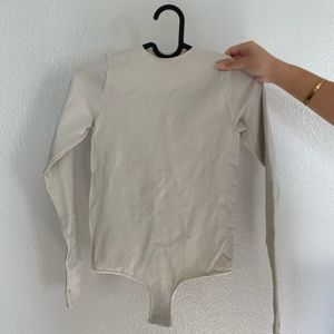 SKIMS Essential Bodysuit Long Sleeve Crew Neck Bodysuit in BONE